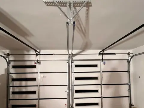 Inside view of garage door tracks and opener rail